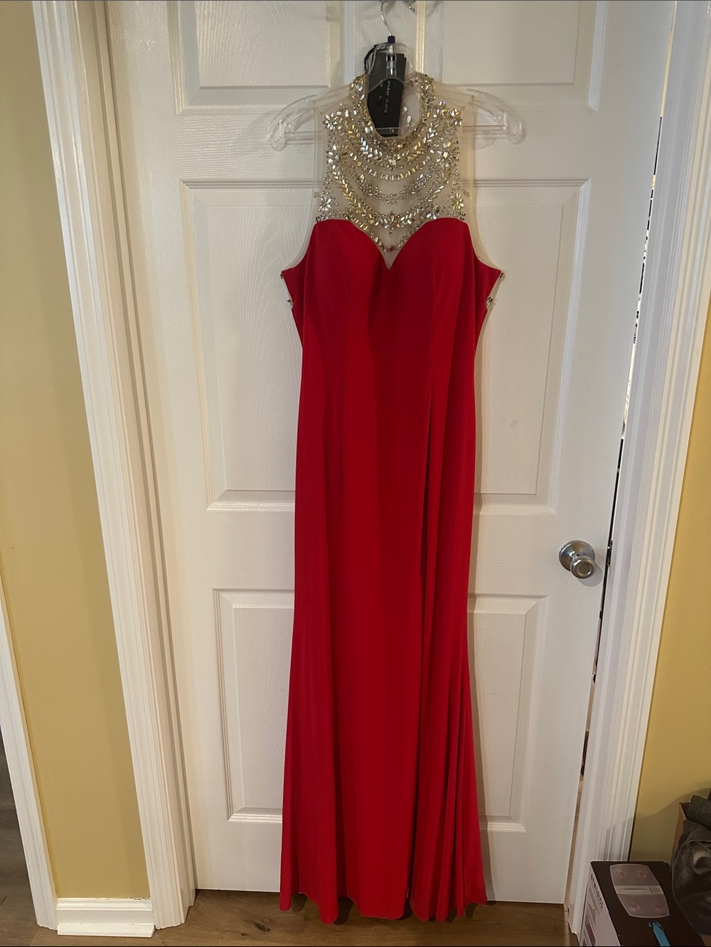 Red formal evening gown with rhinestone embellishments